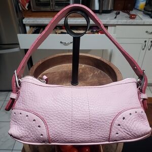 A cute pink leather bag.